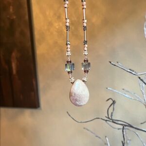 Elegant Beaded Necklace with Teardrop Pendant